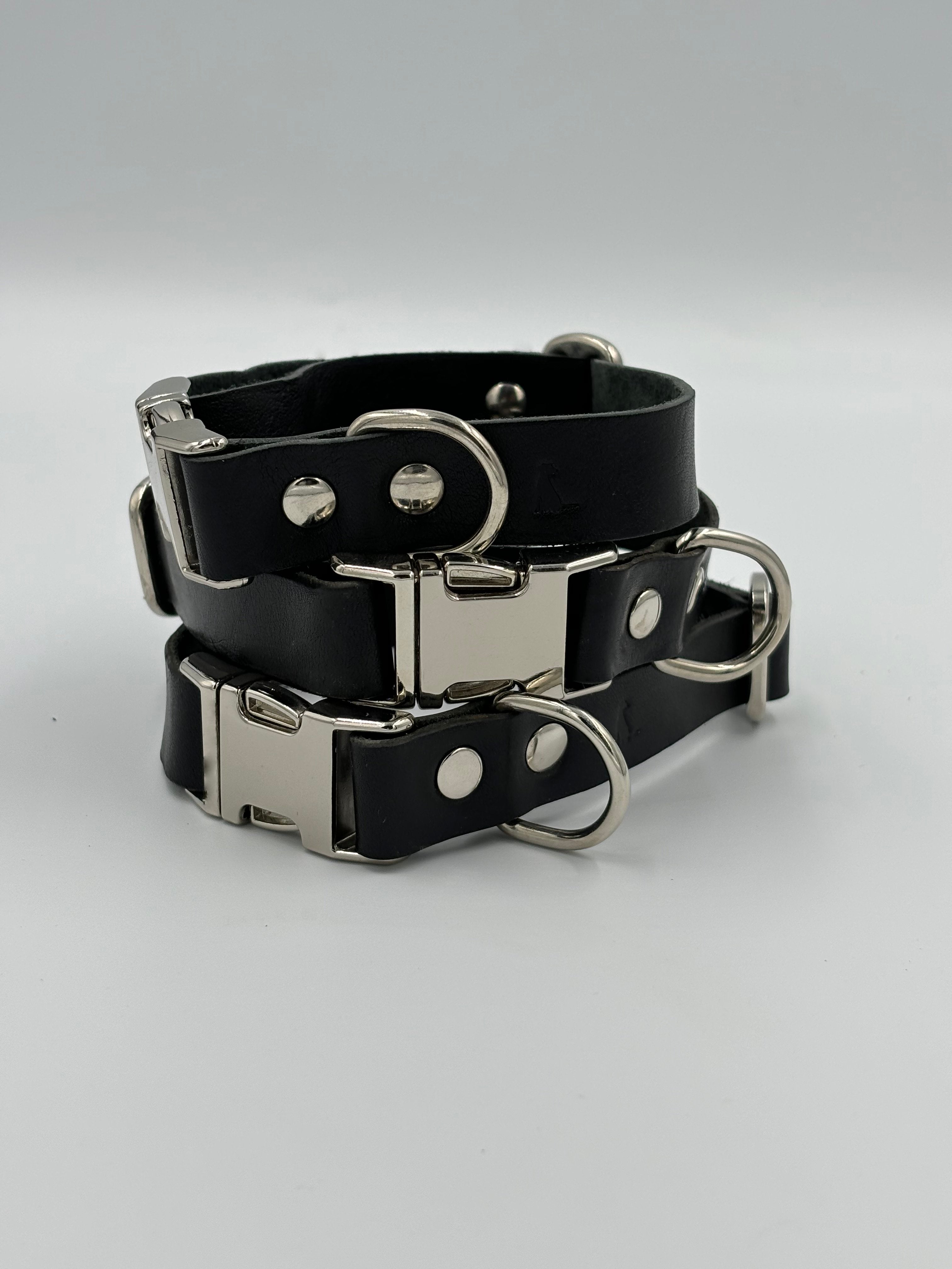 Premium black leather dog collar with silver details, crafted from Italian vegetable-tanned leather for elegant canine companions.