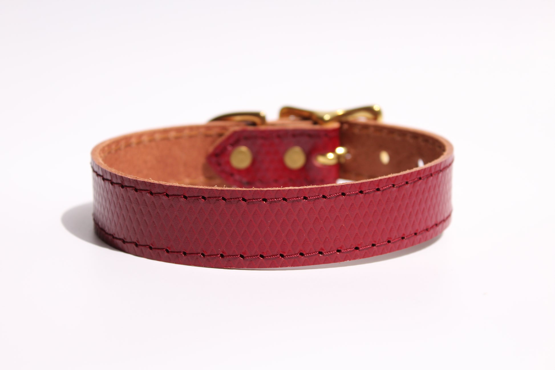 Back view of luxury red leather dog collar, showcasing the smooth, high-quality leather and elegant craftsmanship.